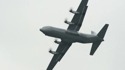 Lockheed C-130J Super Hercules fly along 10963 Stock Footage 24927149