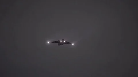 Lockheed C-5M Super Galaxy flies with lights on Stock Footage 113343582