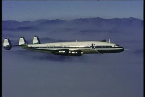 LOCKHEED CONSTELLATION, 1950s, vintage aerial, four propeller plane Stock Footage 12869731