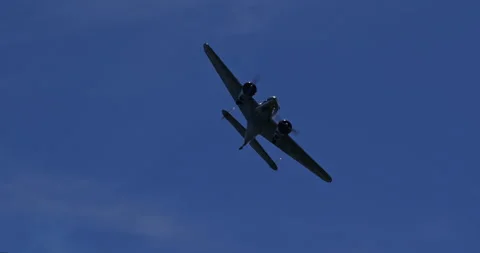 Lockheed L-12 Electra Junior vintage airliner flying overhead Stock Footage 312625153