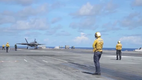 Lockheed Martin F-35 Lightning II Landing and Takeoff from an Aircraft Carrier Stock Footage 121798147
