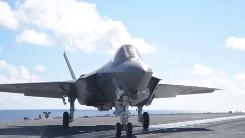 Lockheed Martin F-35 Lightning II rotates on an aircraft carrier Stock Footage 121798173