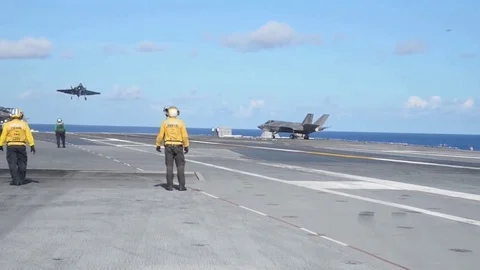 Lockheed Martin F-35 Lightning II Landing on an aircraft carrier. Rope brakes Stock Footage 121798182