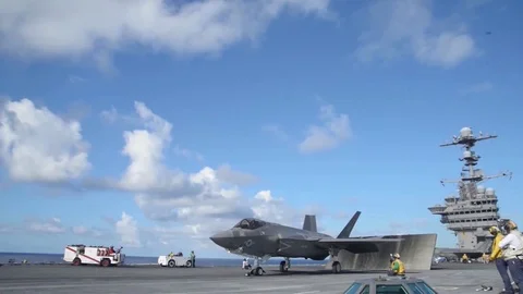 Lockheed Martin F-35 Lightning II picks up speed very quickly and takes off Stock Footage 121798248