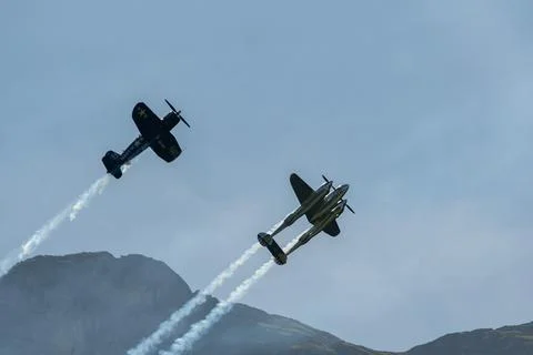 Lockheed P-38L Lightning and a Chance Vought F4U-4 Corsair airplane in Moll.. Stock Photos