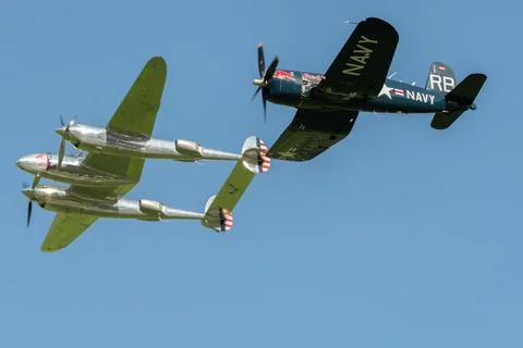 Lockheed P-38L Lightning and a Chance Vought F4U-4 Corsair airplane in Moll.. Stock Photos