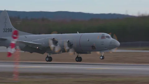 Lockheed P-3C Orion surveillance military aircraft arrival landing slow motion Stock Footage 144099286