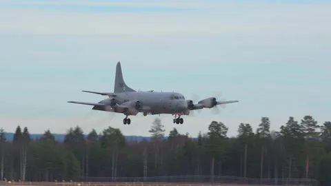 Lockheed P-3C Orion surveillance military aircraft arrival slow motion Stock Footage 144099290