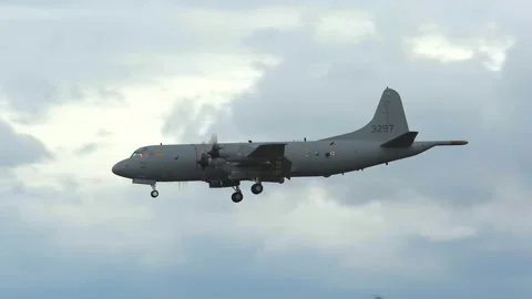 Lockheed p3 orion military airplane in flight silhouette view distant clouds Video stock 154672107