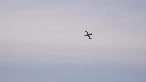 Lockheed T33 jet Military plane doing aerobatics in air show UK 4K Stock Footage 115967251