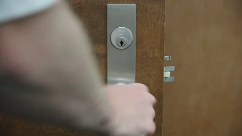 Locking Door With Key And Checking Security Video stock 170386895