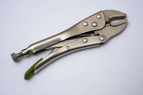 Locking pliers on a white background. Artisan's hand tool close-up Stock Photos