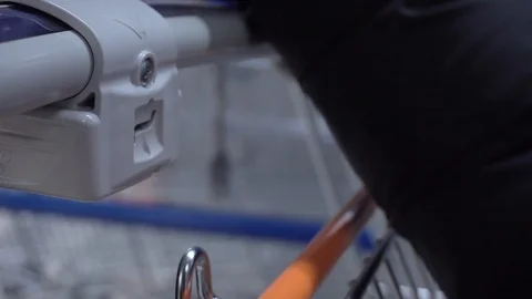 Locking the pushcarts on queue on the grocery store Video stock 100165284