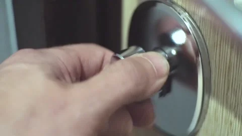 Locking, unlocking a deadbolt on a door. Stock Footage 96847162