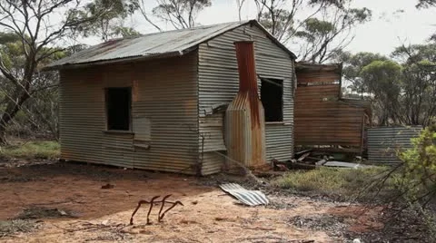 Lockout shot with trees moving in wind of abandonded house, Australia 動画素材 11271122