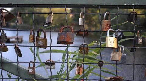Locks attached to a bridge Stock Photos