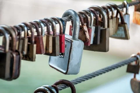 Locks on the bridge in a row Stock Photos
