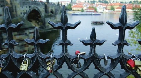 Locks on a fence on a bridge in Prague Stock Footage 67333978