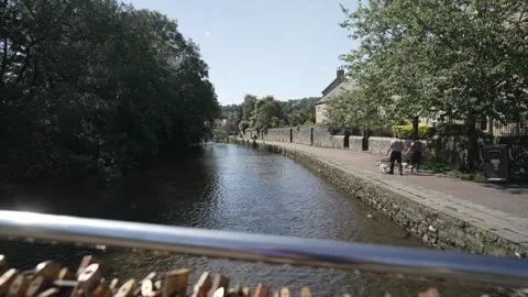 Locks on footbridge and River Wye, Bakewell, Derbyshire, England, United Kingdom Stock Footage 280276100