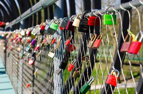 Locks hanging on bridge Stock Photos