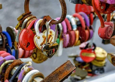 Locks hung on the railing of the bridge according to tradition on the wedding Stock Photos