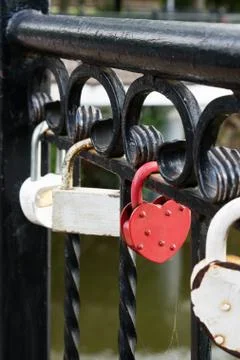 Locks of lovers on the bridge. Stock Photos