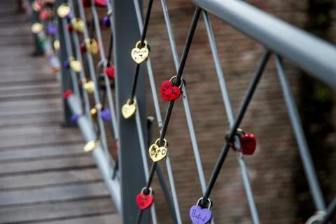 Locks of lovers on the bridge railing Stock Photos