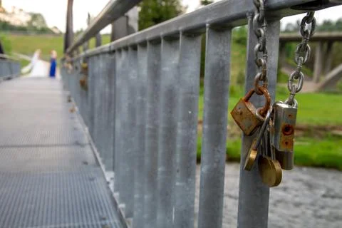Locks on the metal bridge in Latvia. Stock Photos