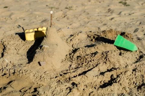 Locks on the sand. Fun in the sand on the beach on a sunny day. Stock Photos