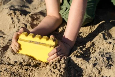 Locks on the sand. Fun in the sand on the beach on a sunny day. Stock Photos