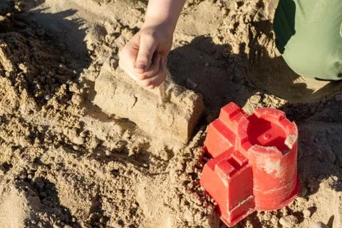 Locks on the sand. Fun in the sand on the beach on a sunny day. Stock Photos