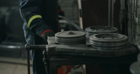 Locksmith bends a metal profile along a certain radius on a bending machine Stock Footage 151834088