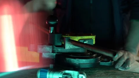 Locksmith bends the pipe to the desired volume Stock Footage 129105894