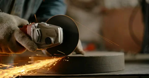 Locksmith cuts sheet metal with a grinder with a lot of sparks in slow motion Stock Footage 151906599