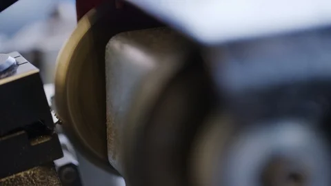 Locksmith cutting a new key with a cutting machine in the workshop Stock Footage 102266987