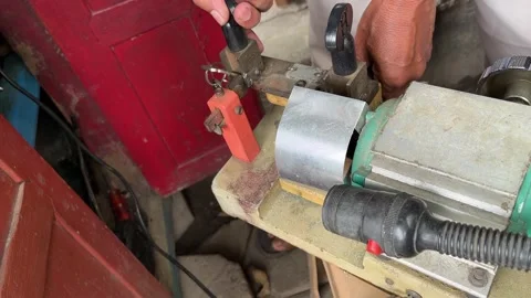 Locksmith duplicates new key from the original with a machine. Stock Footage 245252035