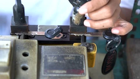 Locksmith Duplicating A Motorcycle Key Stock Footage 201570649