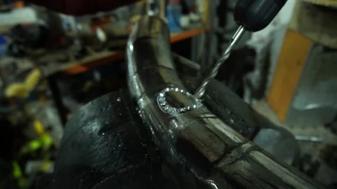 A locksmith performs metal drilling Stock Footage 235727384