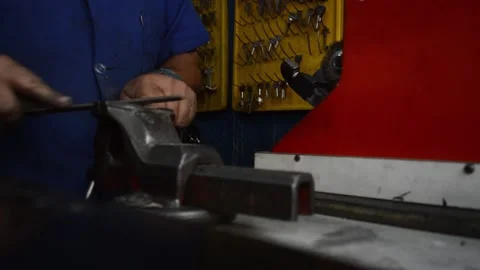 Locksmith prepares a key copy in a shop Stock Footage 140065796