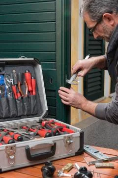 Locksmith repair the lock Stock Photos