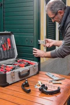 Locksmith repair the lock Stock Photos