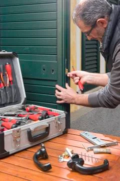 Locksmith repair the lock Stock Photos