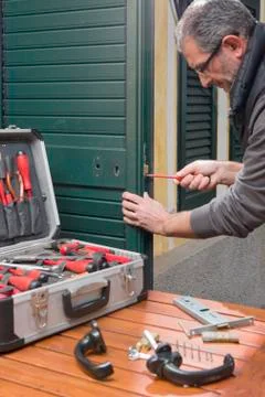 Locksmith repair the lock Stock Photos