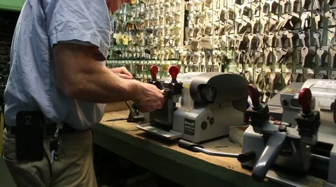 Locksmith Uses Key Grinder to Cut New Keys Stock Footage