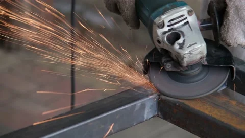 Locksmith working with angle electric grinder tool, sparks flying Stock Footage 234991754