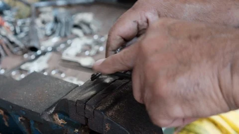 Locksmith working on a key. Handmade work Stock Footage 101597314