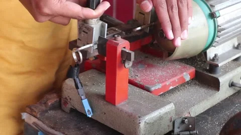Locksmith in workshop makes new key. Stock Footage 328070989