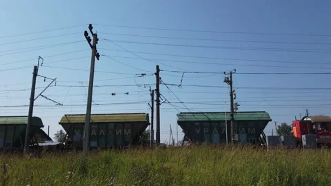 A locomotive pulls a freight train on rails Stock Footage 138637271