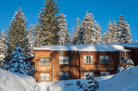 Lodge in winter forest Stock Photos