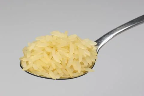 Löffel mit Reis Stock Photos